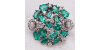 Bague en or blanc, sertie d'émeraudes et agrémentée de diamants