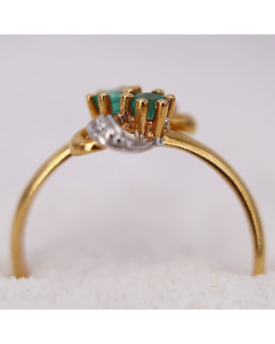 Bague en Or Jaune agrémentée de deux Émeraudes pour Femme